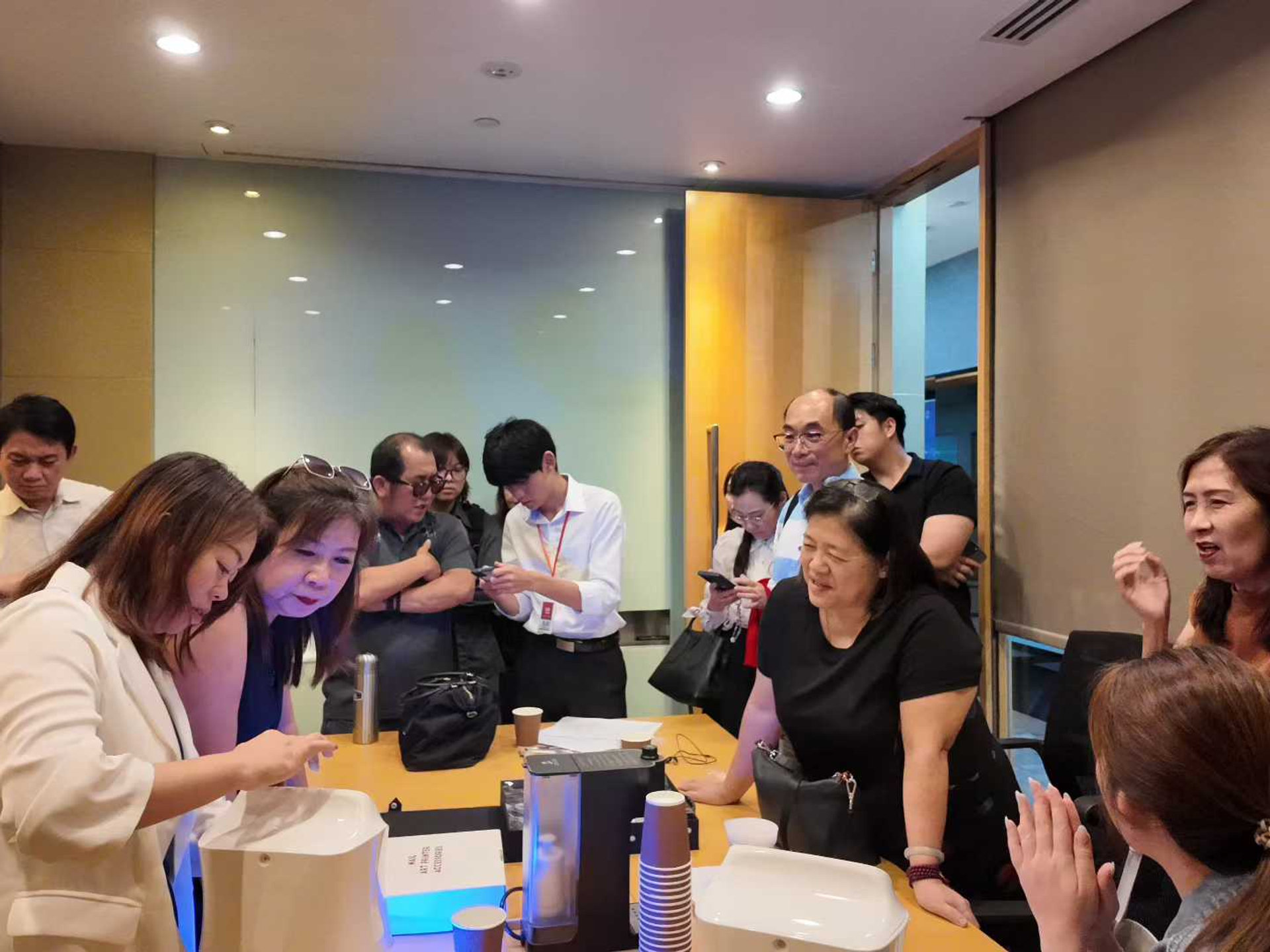 Business professionals networking during AI training break